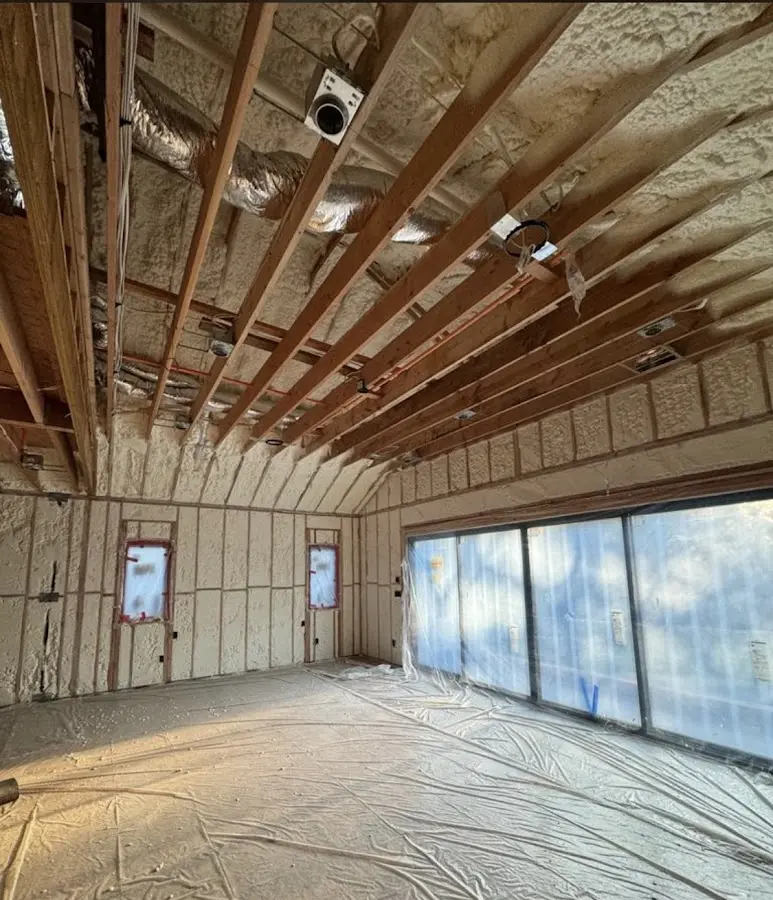 Interior walls and ceiling insulated with spray foam during new construction in Clayton